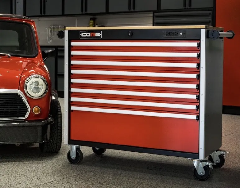 Red CORE toolbox with maple top beside a classic car
