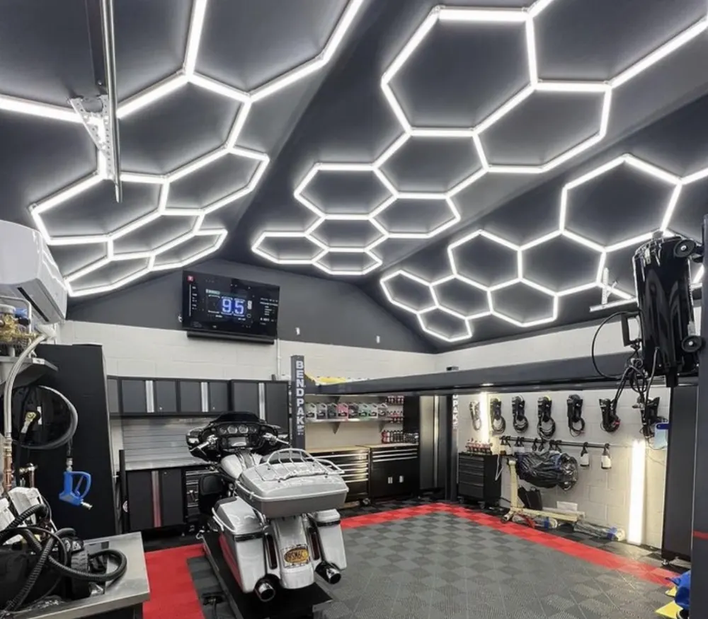 Hex lights on a black vaulted garage ceiling